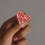 You-are-strong-enamel-pin-in-hand